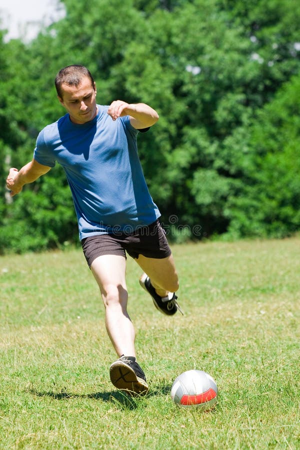 Soccer player kicking the ball