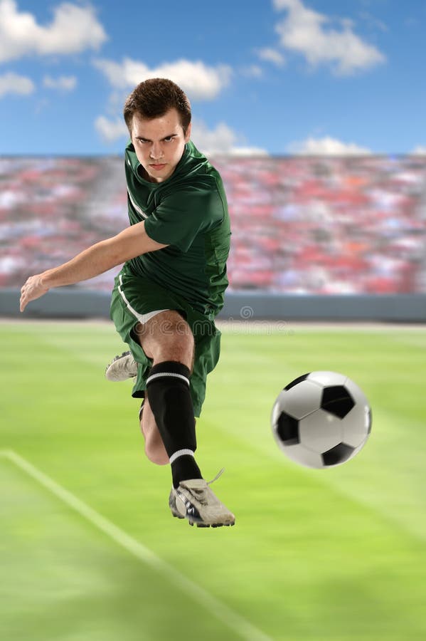 Soccer Player Kicking Ball stock photo. Image of crowd 34881612