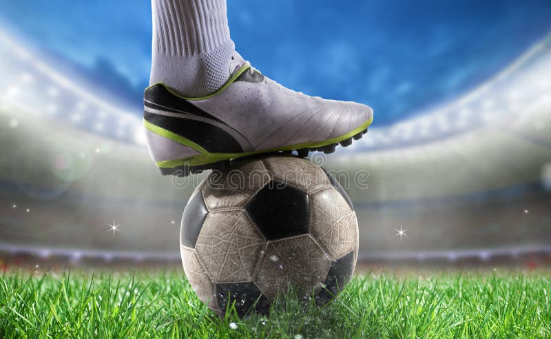 Soccer player with soccerball at the stadium ready for World cup