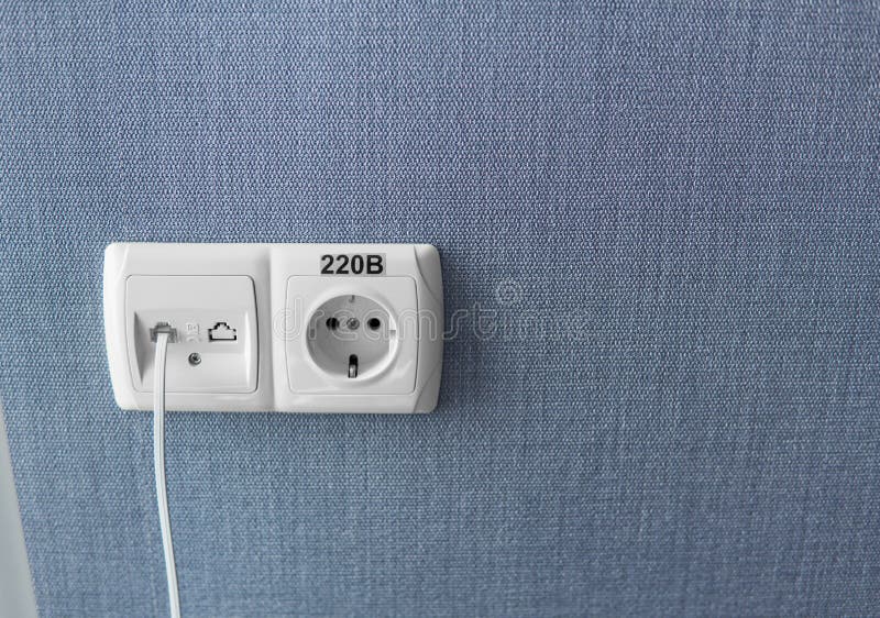 Socket on a Blue Wall, a Multifunction Outlet with an