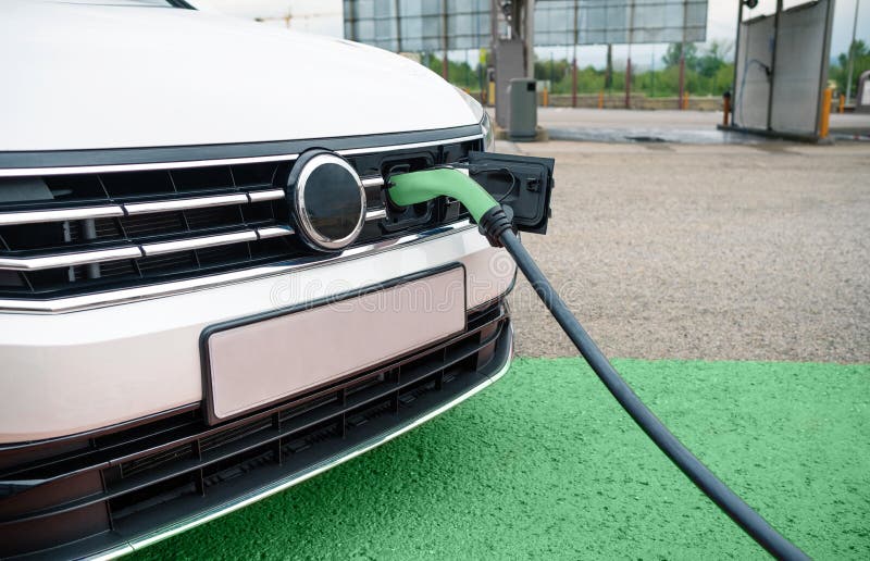 Socket Plugged into Electric Car Stock Photo Image of point