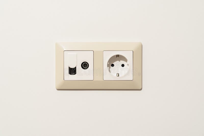 Sockets on White Wall. Multifunction Outlet with Connection