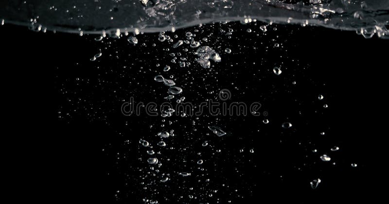 Soda water splashing drop in black background stock image