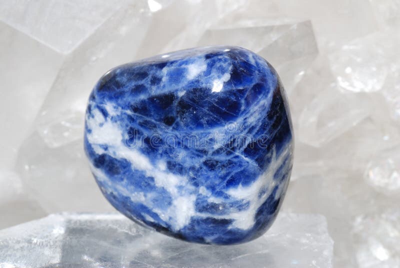 Sodalite laid on druze of quartz royalty free stock photo