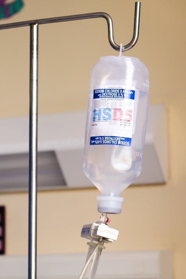 Common body fluid supplement, sodium chloride in a bottle ready to be dripped through infusion pump into a patient body. Common body fluid supplement, sodium chloride in a bottle ready to be dripped through infusion pump into a patient body.