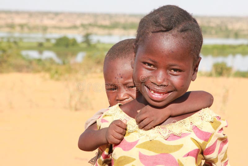 Young girl with her sister on her back. Young girl with her sister on her back