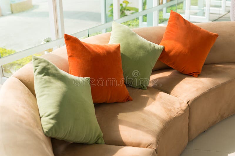 Sofa with Colorful Pillows in Room with Morning Sunlight Stock Photo