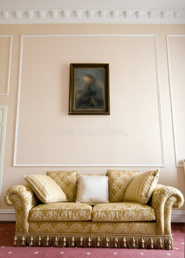 A classic sofa and a painting above it, decorative walls. A classic sofa and a painting above it, decorative walls.