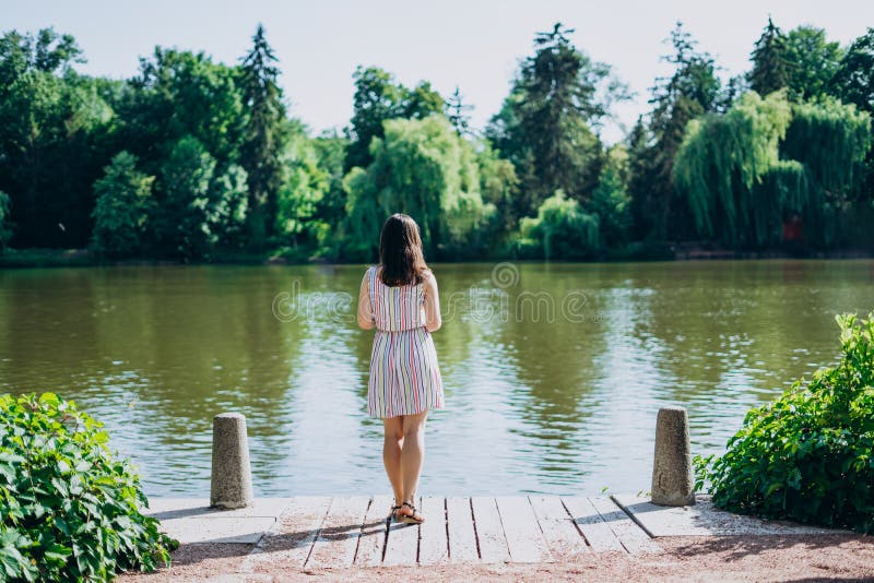 Sofia Park, Uman. Young Woman with a Tourist Map by the Lake. a Woman ...