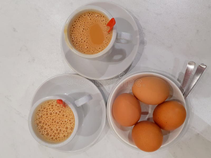 4 soft boil eggs and tea stock image. Image of shell 266059199