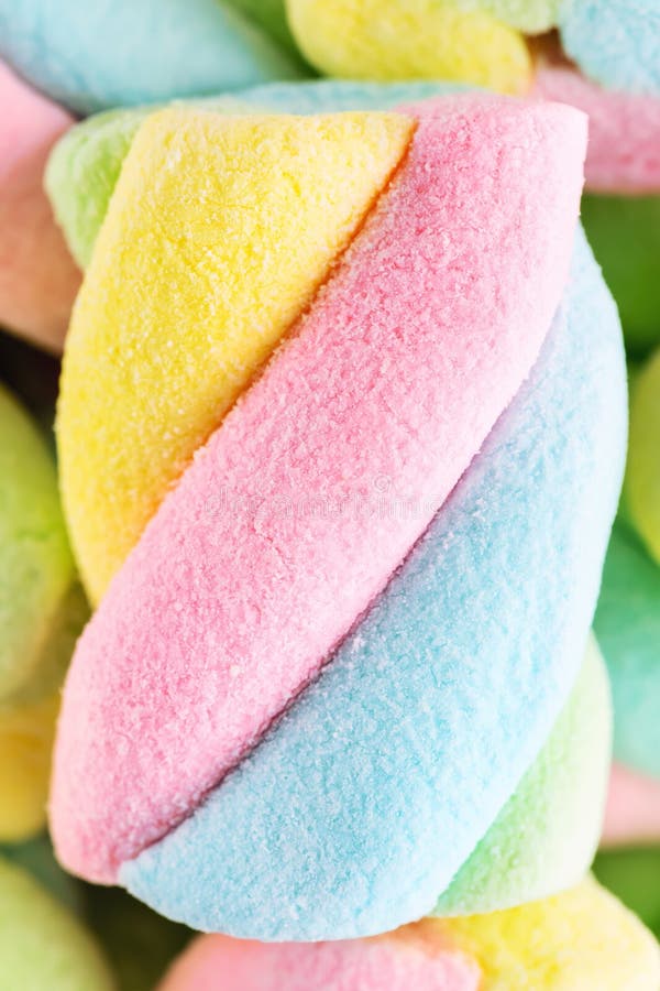 Soft colorful twisted marshmallow background, macro, top view, v
