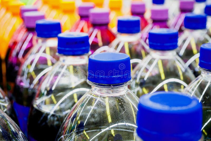 Soft drinks bottles stock photo. Image of purple, cold 99806210
