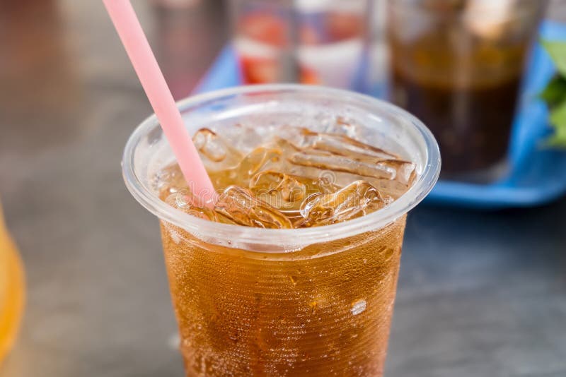 Soft Drinks in Clear Plastic Glasses on the Dining Table Stock Image