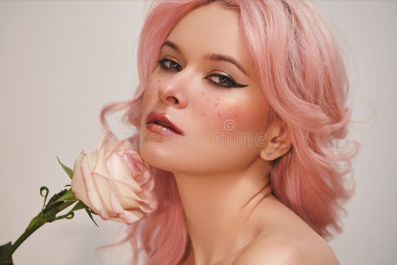 Soft-Girl Style with Trend Pink Flying Hair, Fashion Make-up. Blond Woman Face with Freckles, Blush Rouge, Rose Flowers