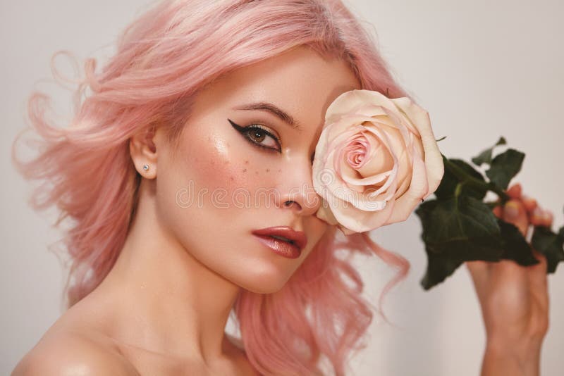 Soft-Girl Style with Trend Pink Flying Hair, Fashion Make-up. Blond Woman Face with Freckles, Blush Rouge, Rose Flowers