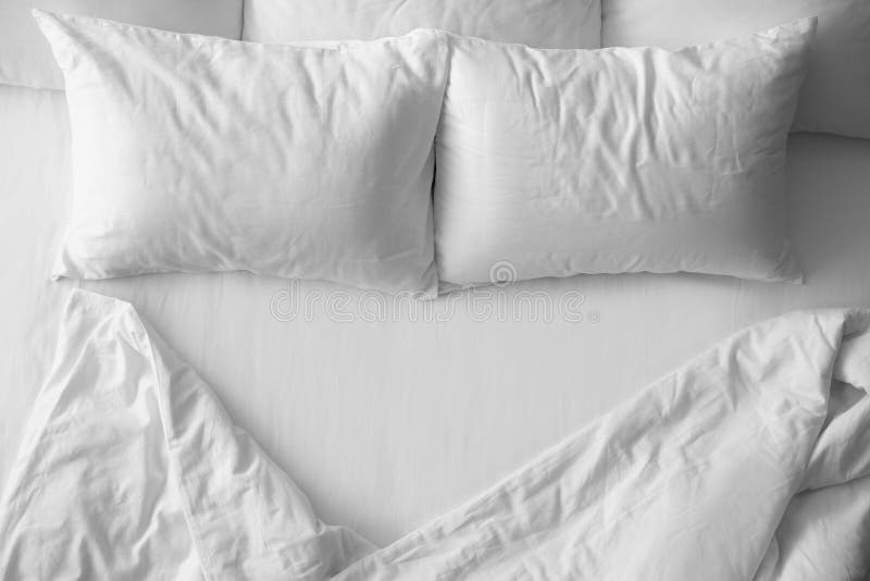 Soft pillows on comfortable bed