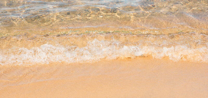 Soft sea wave on sand beach. Summer background. Concept of travel, vocation, relax stock photography