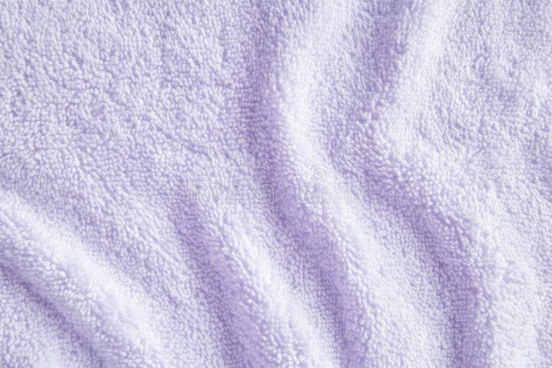 A soft terry cloth fabric texture background in pastel lavender. The plush, absorbent loops create a royalty free stock photo