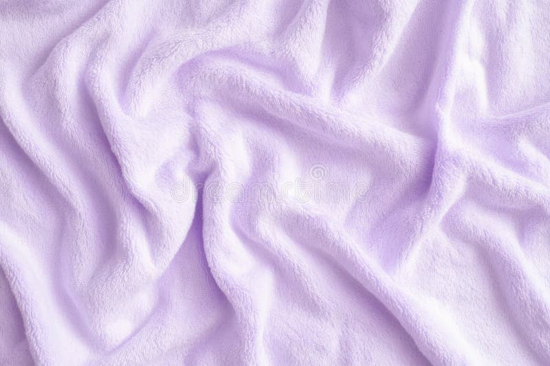 A soft terry cloth fabric texture background in pastel lavender. The plush, absorbent loops create a cozy, spa-like aesthetic, making it perfect for bathrobes, towels, and relaxing self-care essentials. AI generated