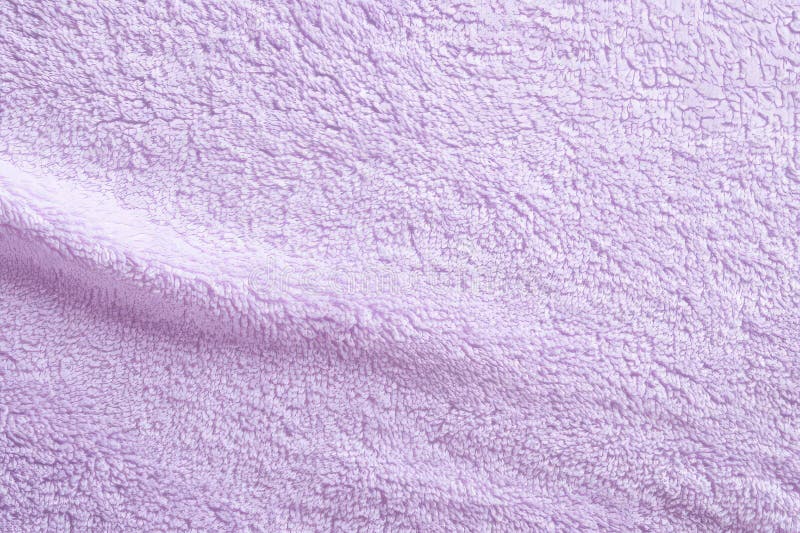 A soft terry cloth fabric texture background in pastel lavender. The plush, absorbent loops create a royalty free stock images