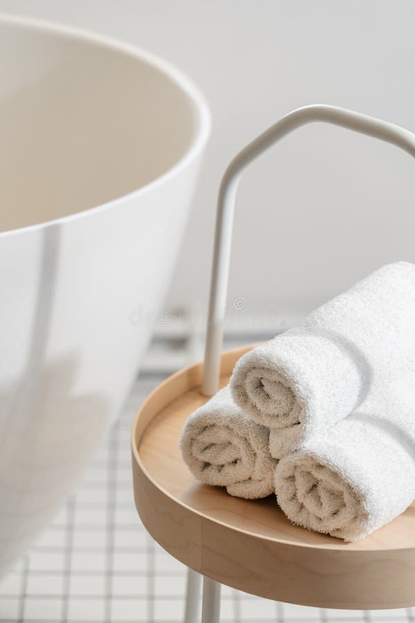 Soft terry towels on the table near wash basin stock images
