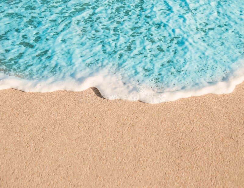 Soft Wave of Blue Ocean in Summer. Empty Sandy Beach Textured Stock