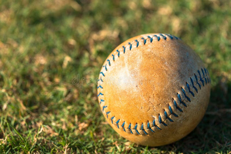 Well Worn Softball Baseball Close Up on Field. Well Worn Softball Baseball Close Up on Field