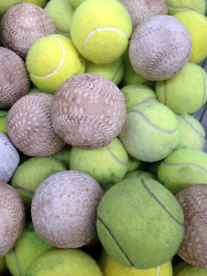 Softball with Tennis ball stock image. Image of blow 50159929