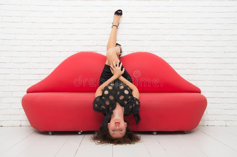 Softer than silk. fashion model has sexy smooth legs. sexy woman resting on sofa. beautiful girl lying on sofa. Sexy