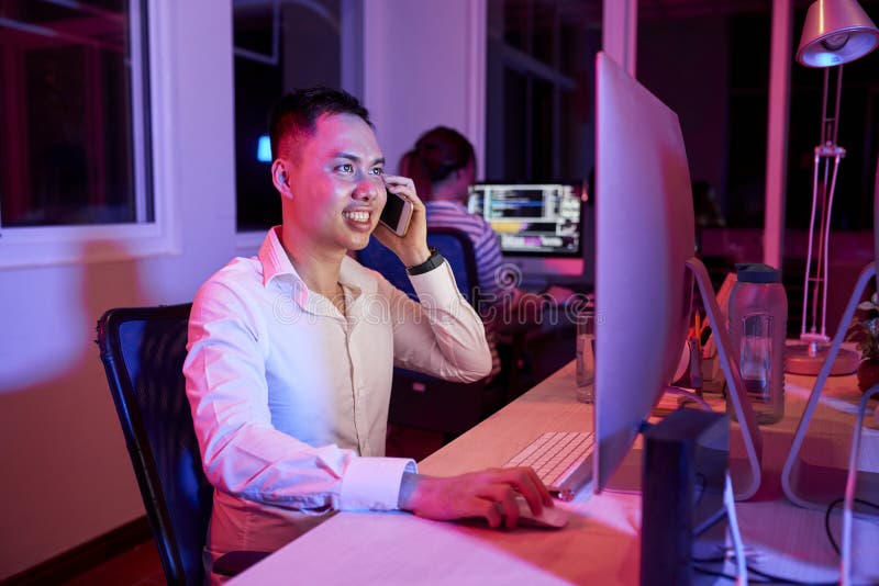 Software Developer Answering Phone Call royalty free stock photography