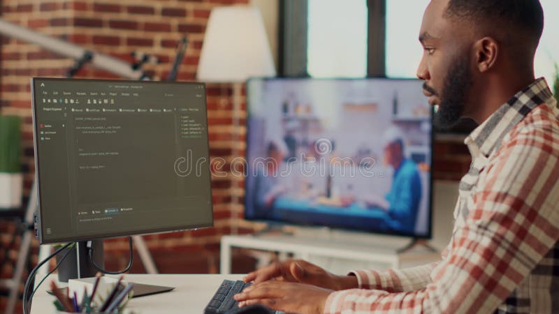 Software developer programming html code on computer software developer programming html code on computer working remote from home