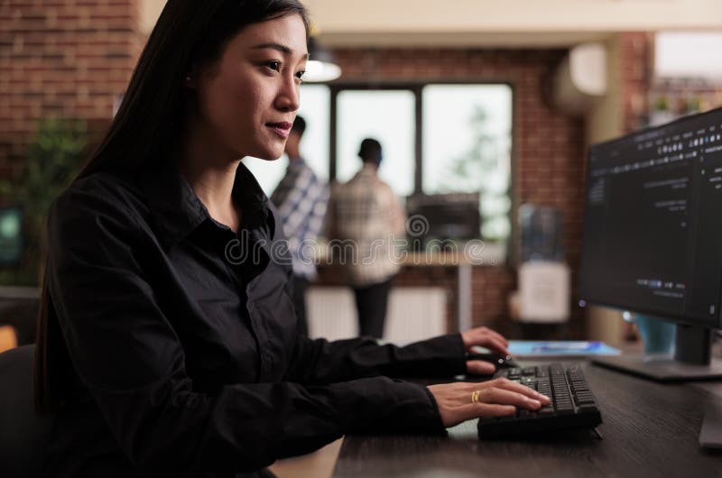 Software developer writing javascript code on terminal window in row specific context software developer writing javascript code