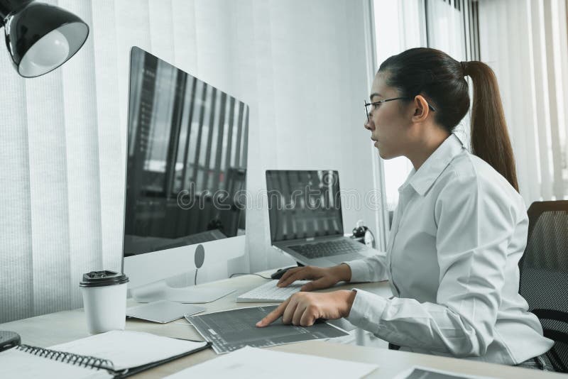 Software developers are analyzing about the code written into the program on the computer in office room royalty free stock images