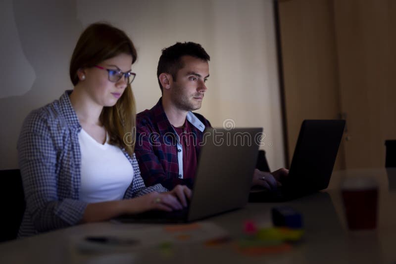 Software developers working overtime stock image