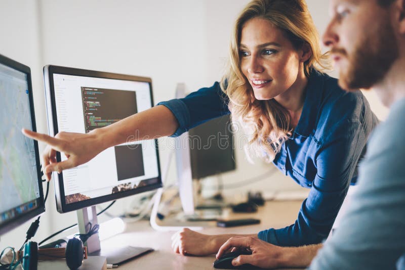 Software engineers working on project and programming in company royalty free stock photos