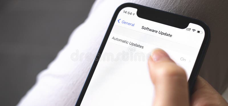 Software update screen on mobile phone close-up, automatic update button, banner photo stock photos