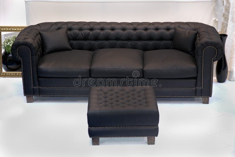 Black leather vintage sofa with leg rest ottoman. Black leather vintage sofa with leg rest ottoman