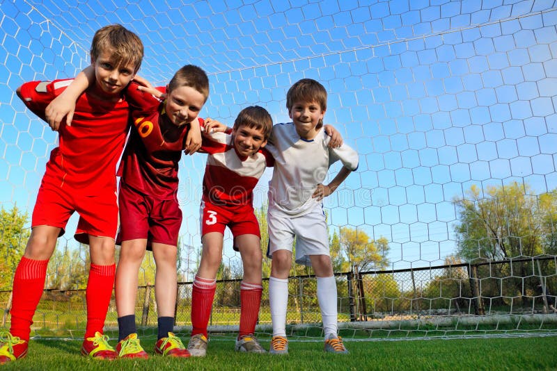 Group of Little Boys stay next to goal. Group of Little Boys stay next to goal