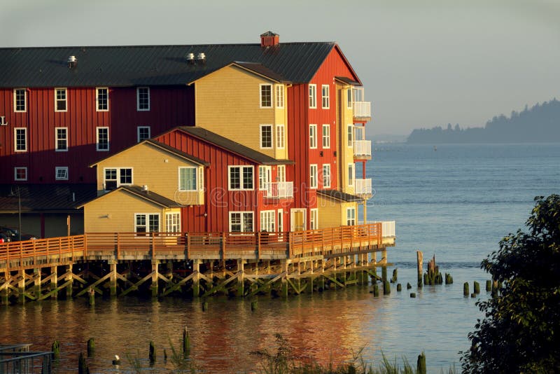 A large luxury waterfront hotel at sunrise, sits on stilts over the river with territorial views over the river gets bathed in sunshine. A large luxury waterfront hotel at sunrise, sits on stilts over the river with territorial views over the river gets bathed in sunshine.