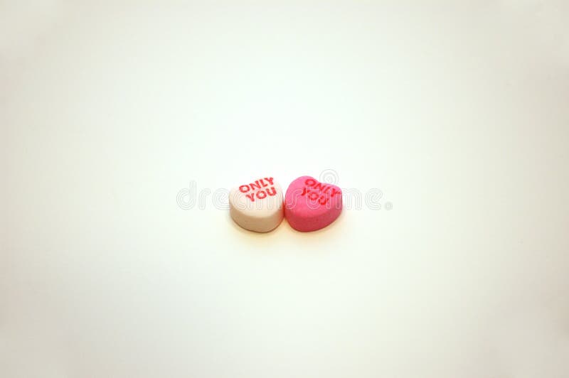 A pair of Only You Valentine&#x27;s Day candy conversation hearts. A pair of Only You Valentine&#x27;s Day candy conversation hearts