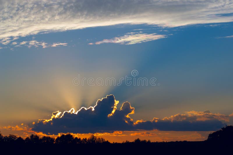 Solar beams behind cloud