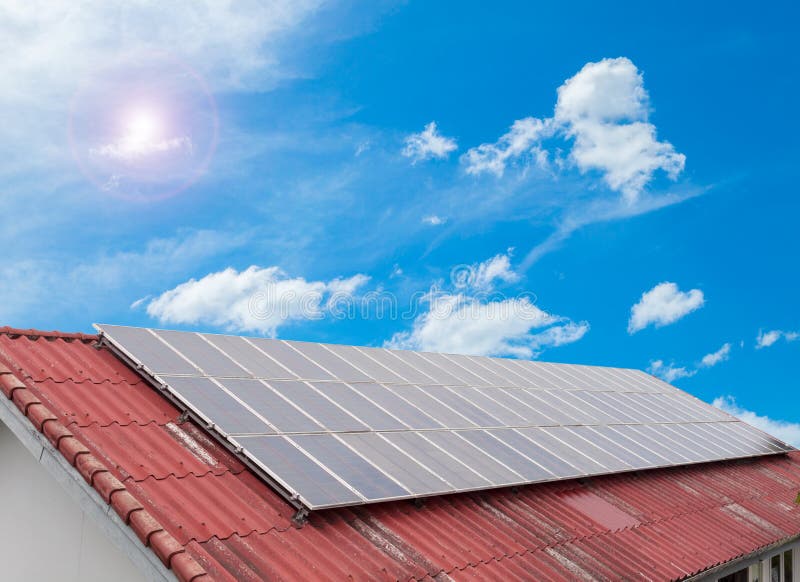 Solar cell panel on red roof and cloud blue sky , Energy saving