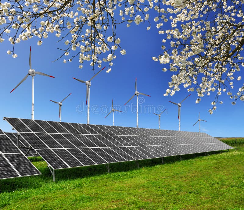 Renewable Energy Concept with Solar Panels and Wind Turbines on Green