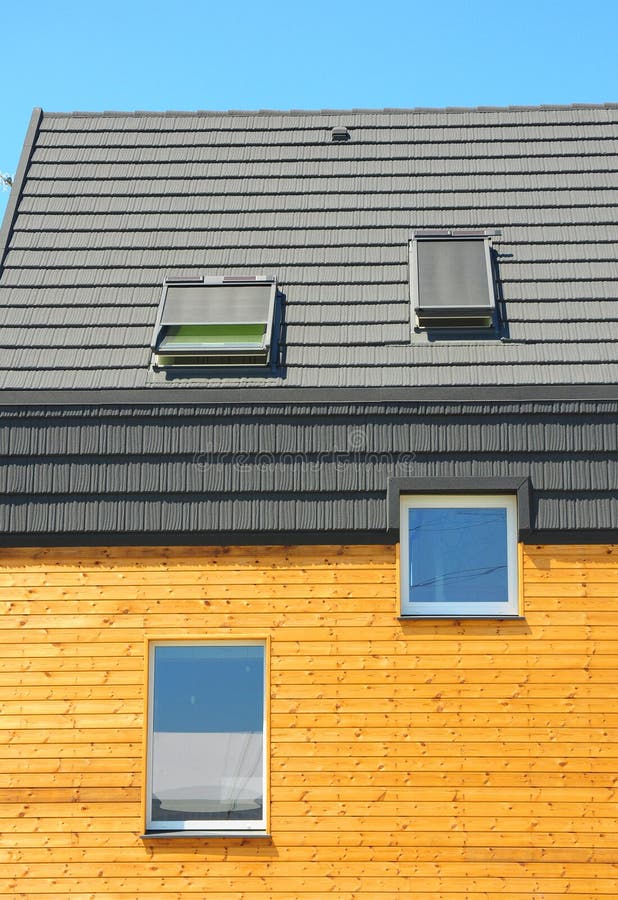 Solar Energy, Solar Panels, Skylights, Ventilation. Modern windows and attic skylights designs. New Building House Energy Efficiency Solution Concept Outdoor stock photography Solar Energy, Solar Panels, Skylights, Ventilation. Modern windows and attic skylights designs. New Building House Energy Efficiency Solution Concept Outdoor stock photography