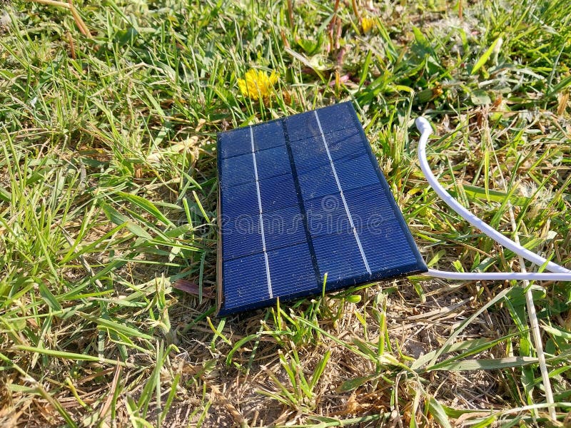 Solar Panel for Charging a Smartphone on the Grass Stock Image Image