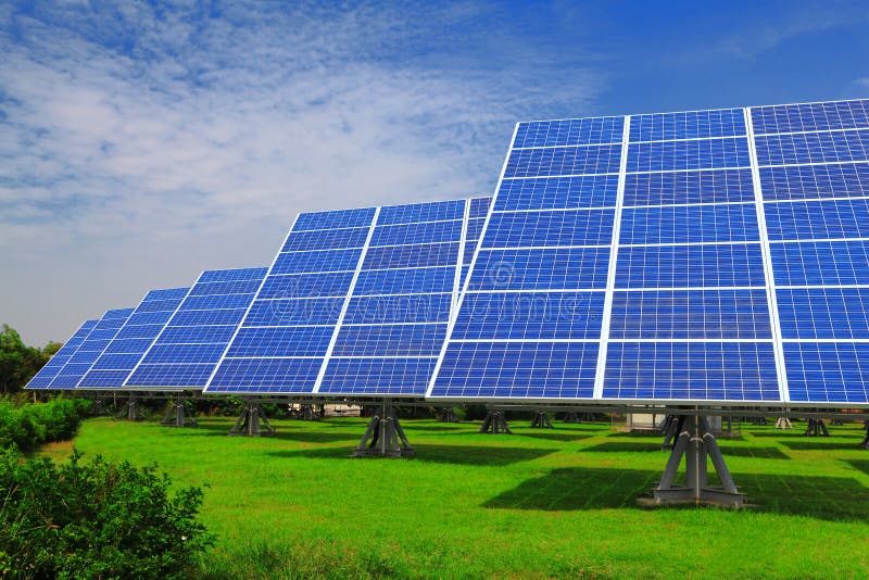 Solar Panel with green grass and beautiful blue sk stock photo