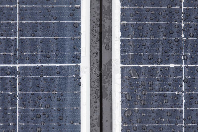 Solar panel in winter. Solar panels are covered with snow on the roof of the building, the use of modules in difficult