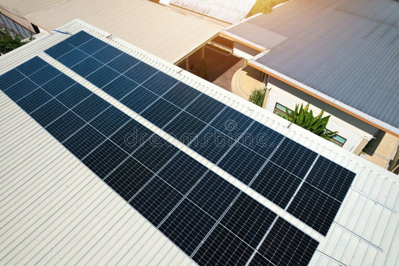 Solar Panels Installed on a Roof of a Large Industrial Building or a