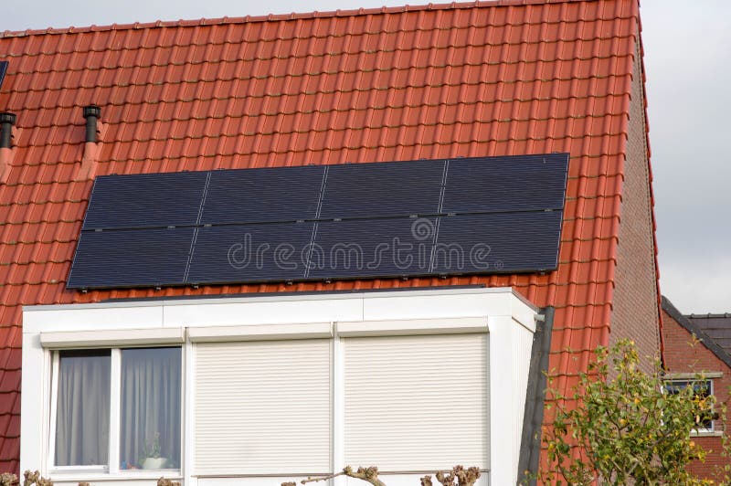 Solar panels on a red roof stock photo. Image of netherlands 200535766