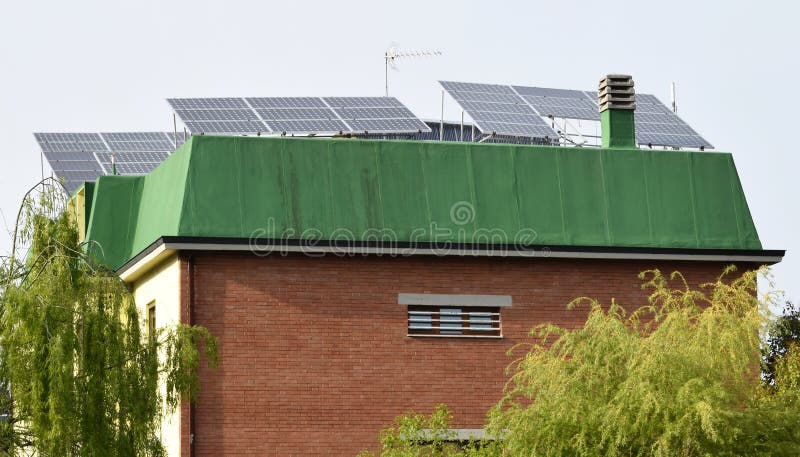 Solar Panels for renewable electrical energy production on the roofs stock photos